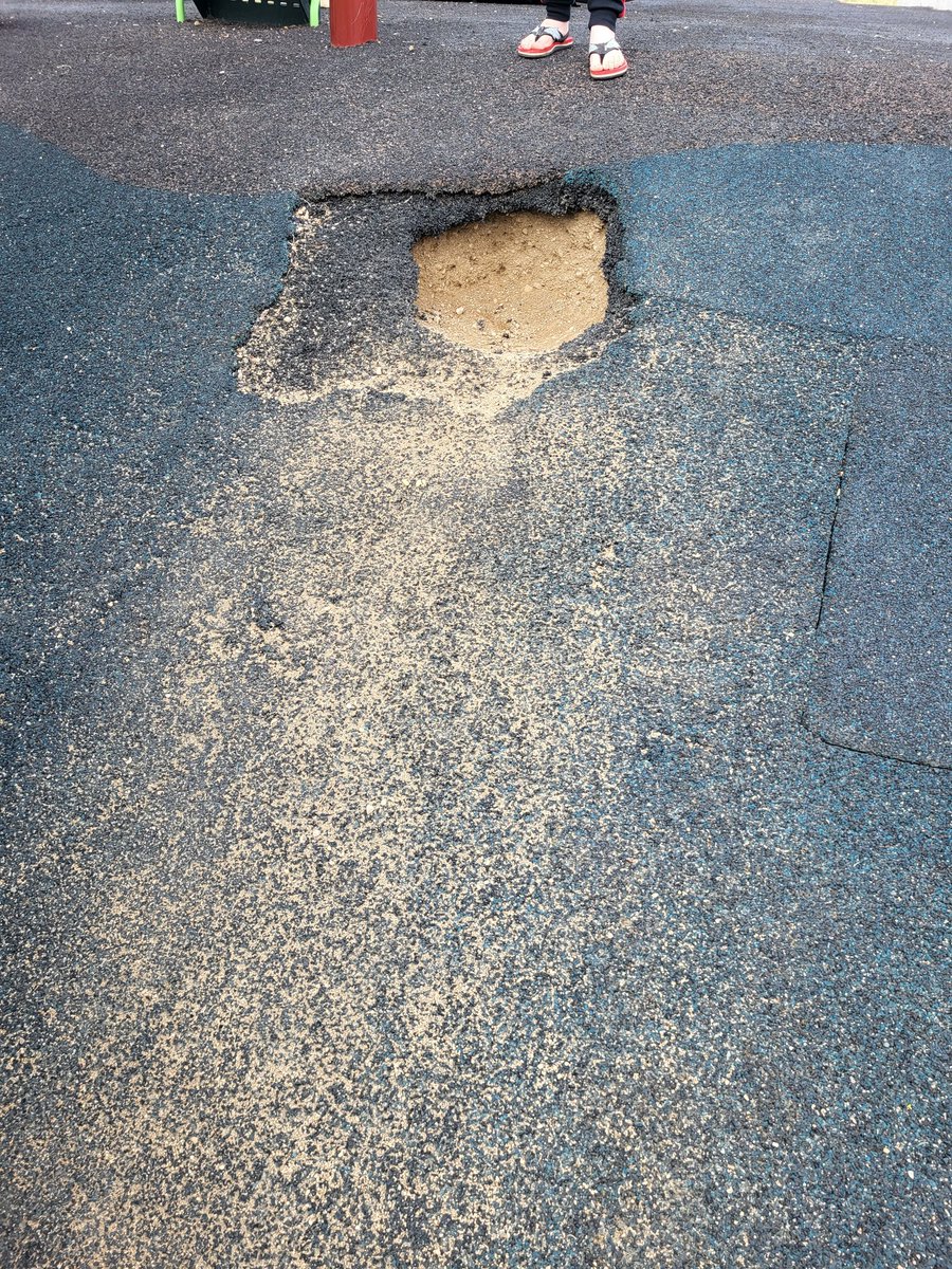 cpaul2011's tweet photo. @loribresciani @CityofRegina can this get fixed asap? It's an accident waiting to happen. How bout we rip this up and put down gravel or woodchips as clearly this material is not working. Such a nice new-ish park but looks terrible with the holes and patch work. Thanks! https://t.co/82CfOhpv88