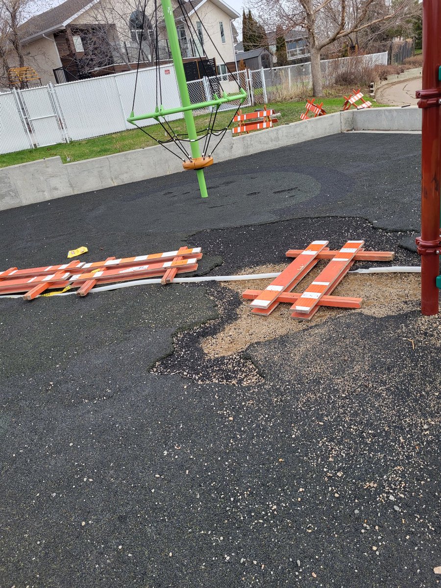 cpaul2011's tweet photo. @loribresciani @CityofRegina can this get fixed asap? It's an accident waiting to happen. How bout we rip this up and put down gravel or woodchips as clearly this material is not working. Such a nice new-ish park but looks terrible with the holes and patch work. Thanks! https://t.co/82CfOhpv88