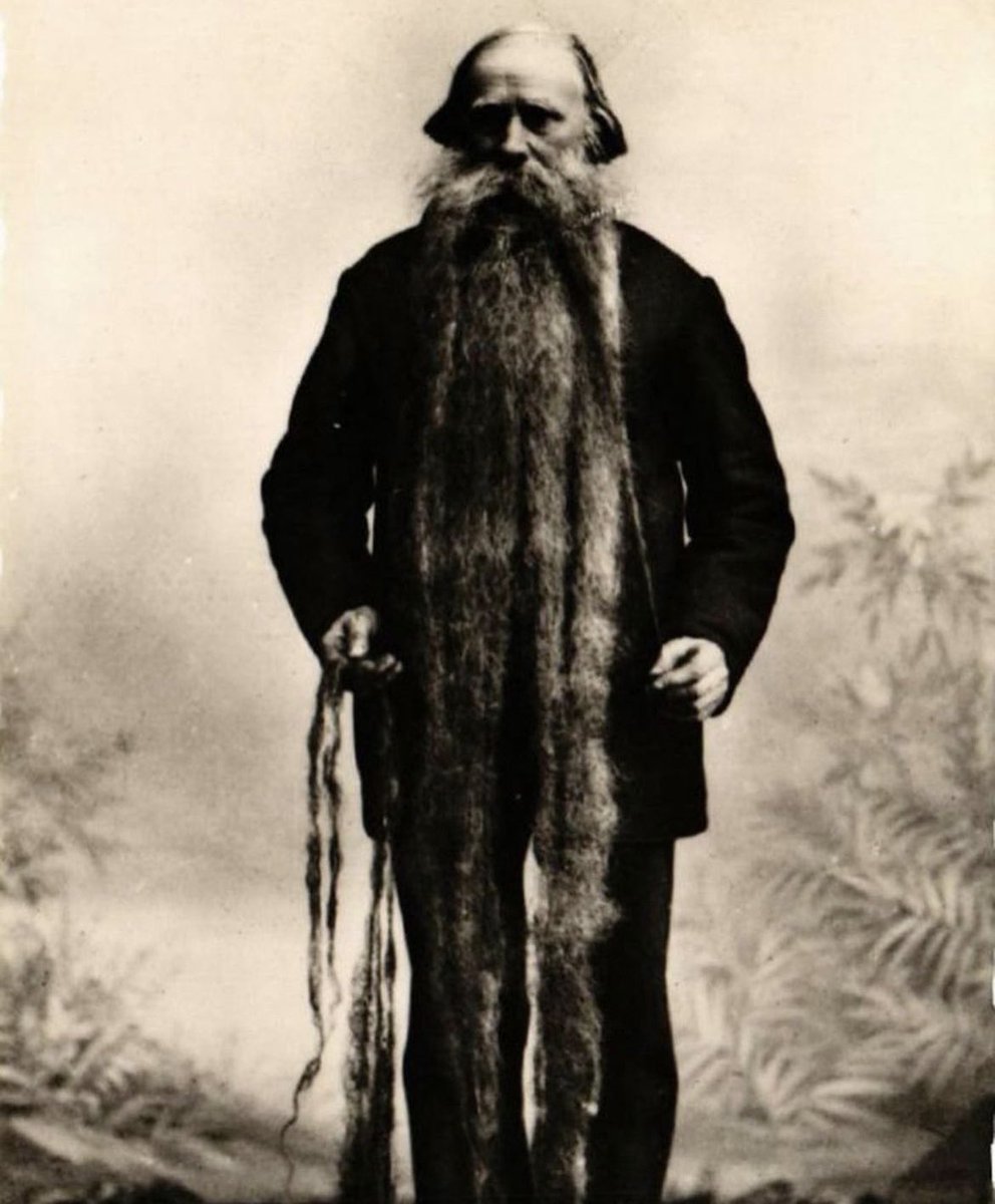 historyinmemes's tweet photo. Louis Coulon, who was born in 1826, started shaving by the time he was 12 years old, and his beard grew so quickly that by the time he was 14, Coulon already had a 50 centimetre (19.6 inch) beard. He just let it grow because he could not keep up with shaving. It was 3.3 metres (11 feet) long by 1904 and used to house his cats.