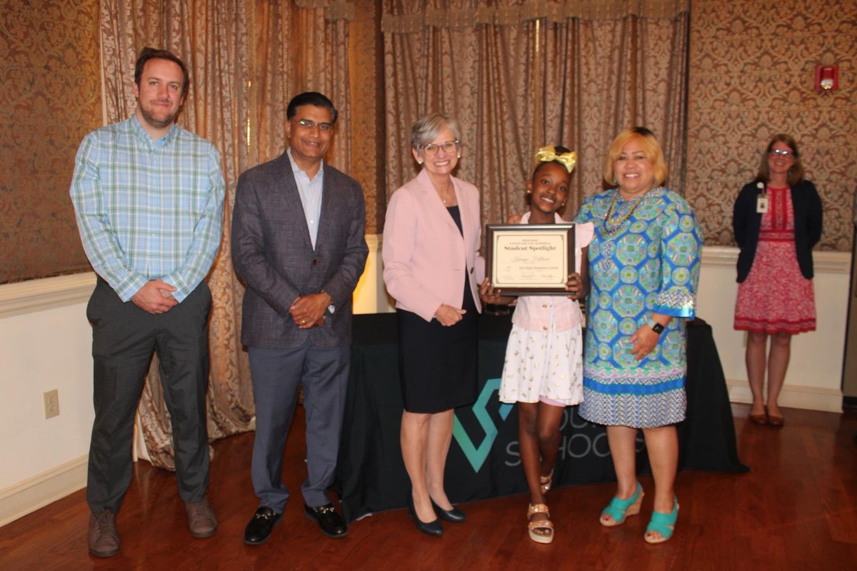 New Hope Elementary Spotlight student receives a plaque at the Spotlight Dinner.   Way to go Wildcat Kamiya!!!