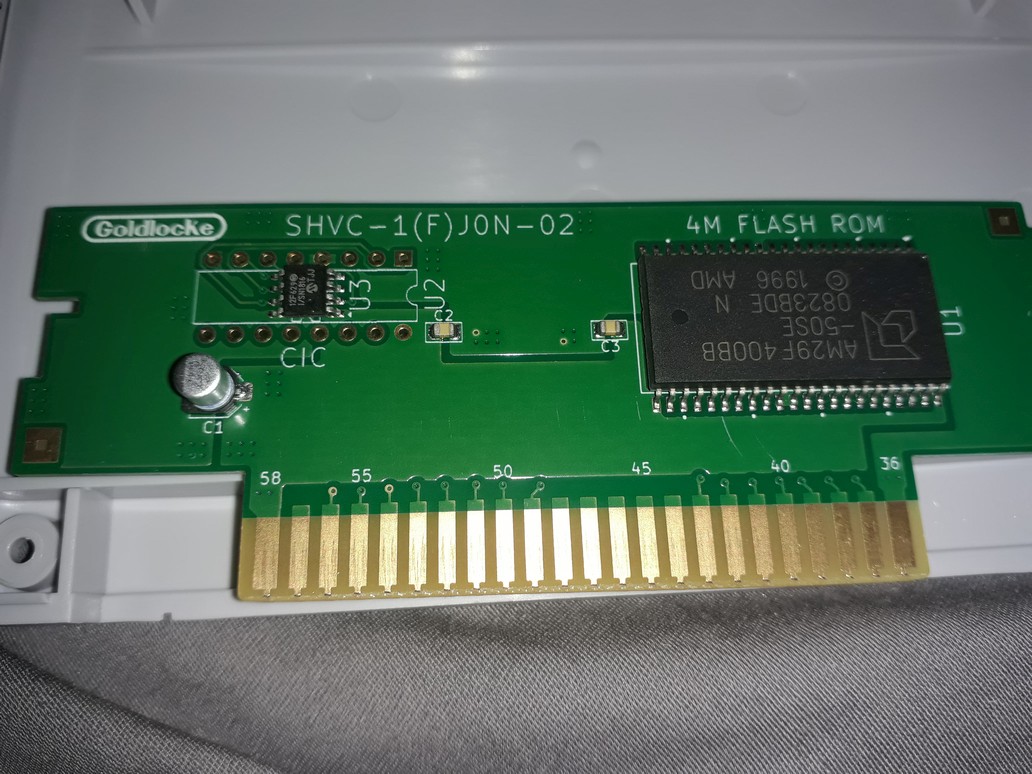 bbbradsmith's tweet photo. Supercooked! A new SNES game by @Goldlocke7. I'm looking forward to playing this.

Wonderful package. The cartridge has real screws, and a simple 5V flash board inside.

Free ROM download: https://t.co/VNM4wVTMF8 https://t.co/8WxFSOT96X