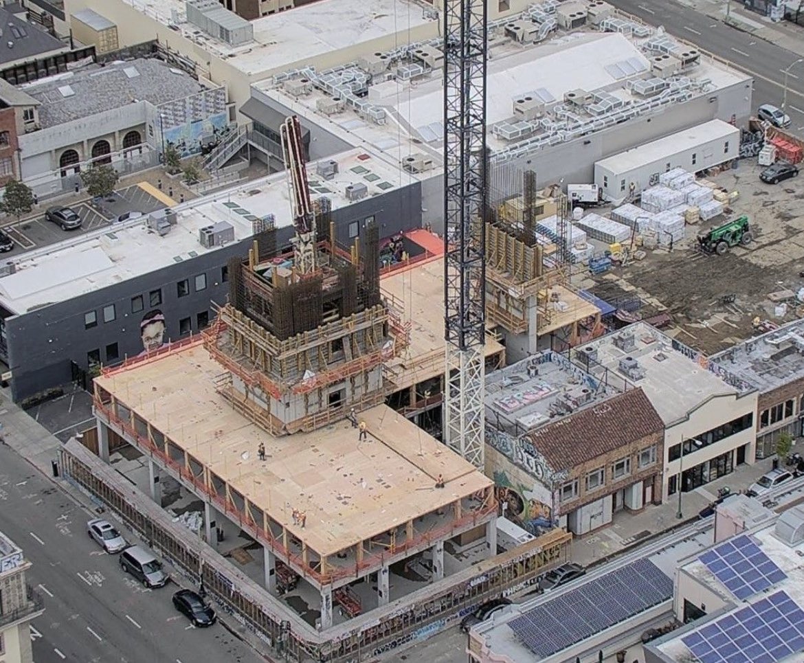 CohenSite's tweet photo. A mass timber building (1510 Webster) under construction in Oakland. The entire floor was built in a single day https://t.co/k51YTTTUUg