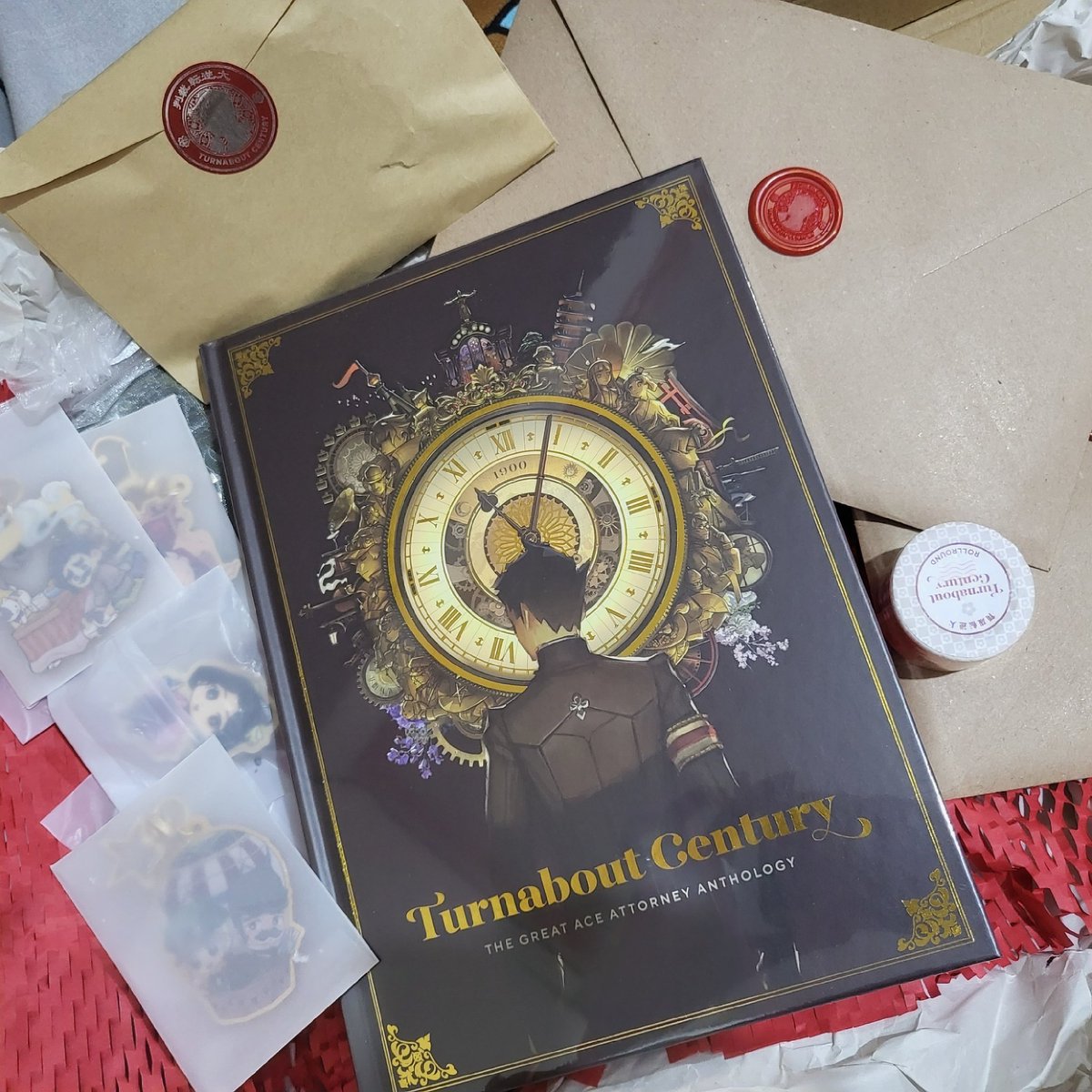 FINALLY got my copy of <a href="/TGAAzine/">TURNABOUT CENTURY ✨</a> and everything looks so beautiful! I dont want to rip open the sealed envelopes but i want to see the pretty art and merch 😭