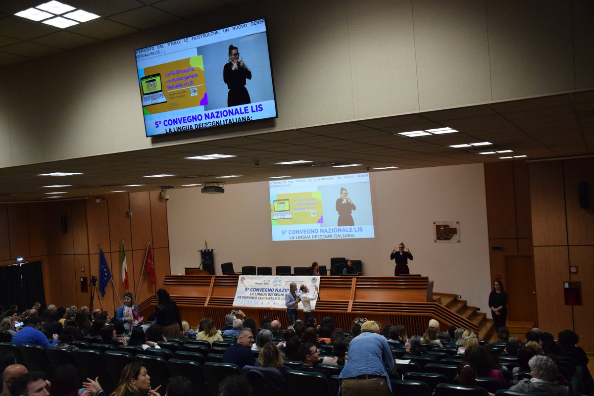 ENS_Italia's tweet image. 🤟#5ConvegnoLIS Susanna Ricci Bitti e Grace Giacubbo de @iltrenoonlus - coop. di persone #sorde e udenti che promuove il #bilinguismo LIS/italiano - ci introducono ad un nuovo genere testuale in #LIS, le FiLIStrocche per #bambini sordi.

📄Il programma: ens.it/wp-content/upl…