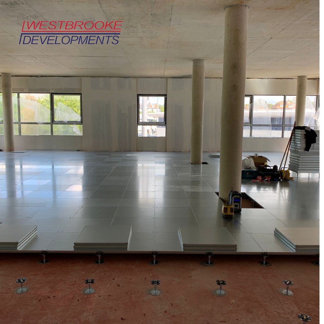 WestbrookeDev's tweet photo. Exciting progress update on our commercial/office space build! The raised flooring is now being installed, getting us one step closer to welcoming our new occupants. We can't wait to see the finished space! #OfficeBuild #CommercialSpace #ConstructionUpdate #TateResidences #Hove https://t.co/5CqsnA0vfR