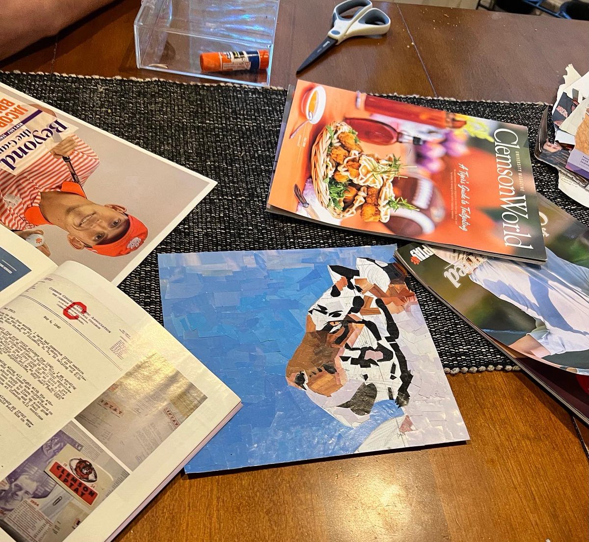 Our artistic kid’s latest work in progress is made mostly out of Clemson magazines, and she tells me it’s “not good”. Mmmkay. I believe she is wrong &amp; aim to prove it. 🐅 <a href="/ClemsonUniv/">Clemson University</a> <a href="/clemsonworld/">Clemson World</a> <a href="/IPTAY/">IPTAY</a> <a href="/ClemsonAlumni/">Clemson Alumni Assoc</a> <a href="/ClemsonTigers/">Clemson Athletics</a> <a href="/daboswinney/">daboswinney</a> <a href="/ClemsonFB/">Clemson Football</a> #ClemsonFamily