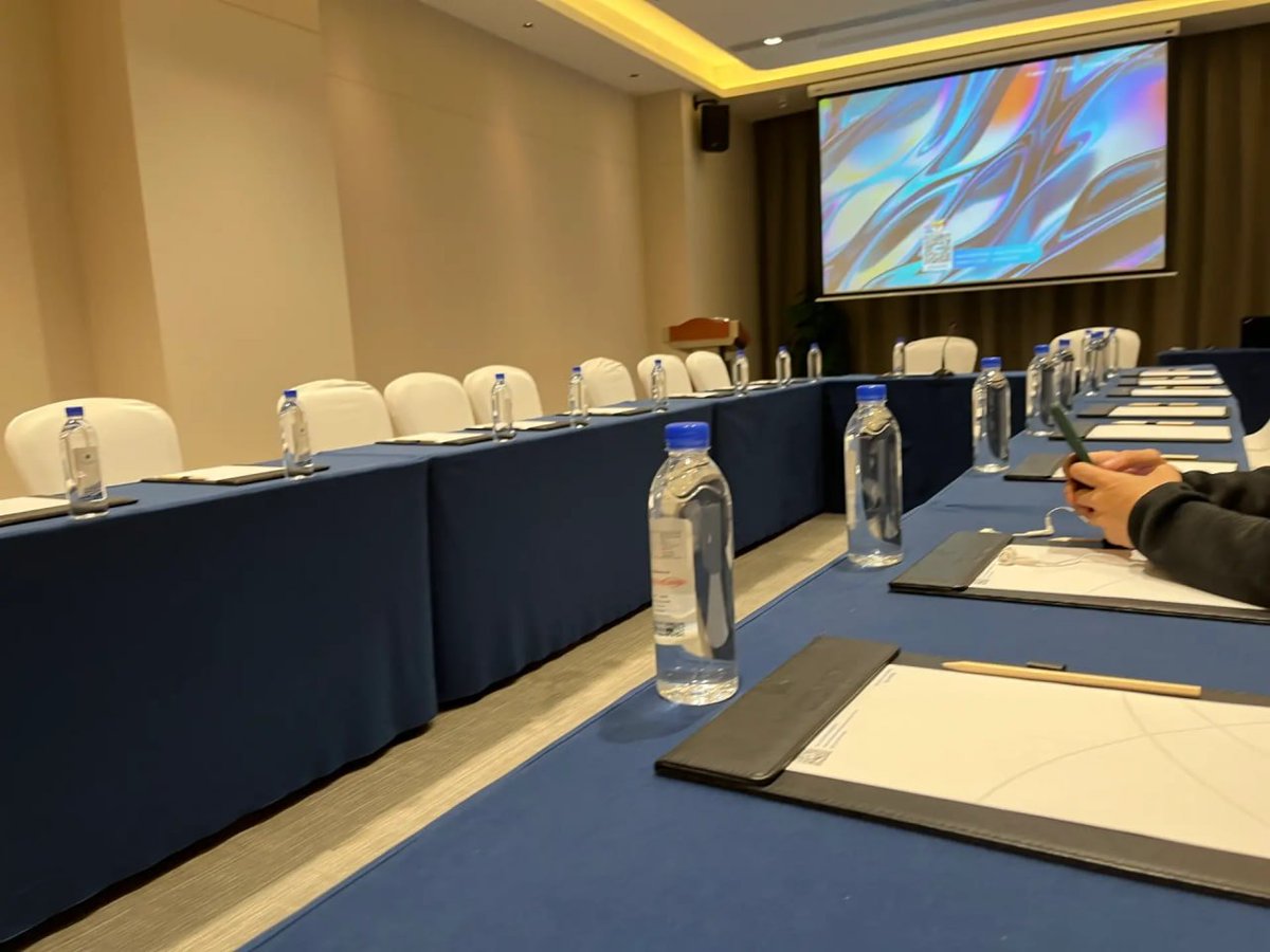 I was attending a workshop for a conference. When we arrived in the conference room early, there were only two of us and we had to sit separately.