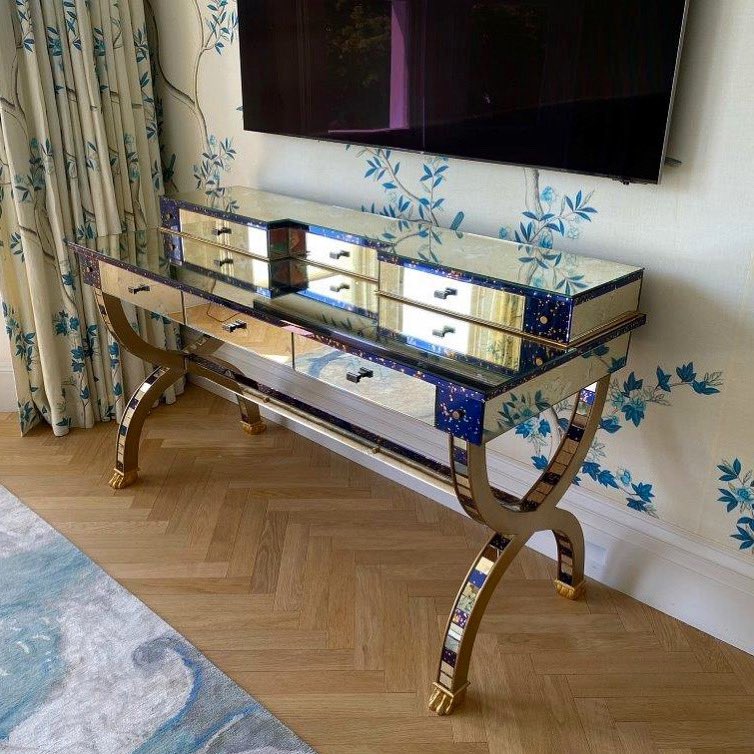 Preedy Glass supplied their customer with antique mirror tiles of ‘Verona’ and ‘Vincenzo Clear’ which they used to clad this beautiful dressing table. #antiquemirror #dressingtable #interiors