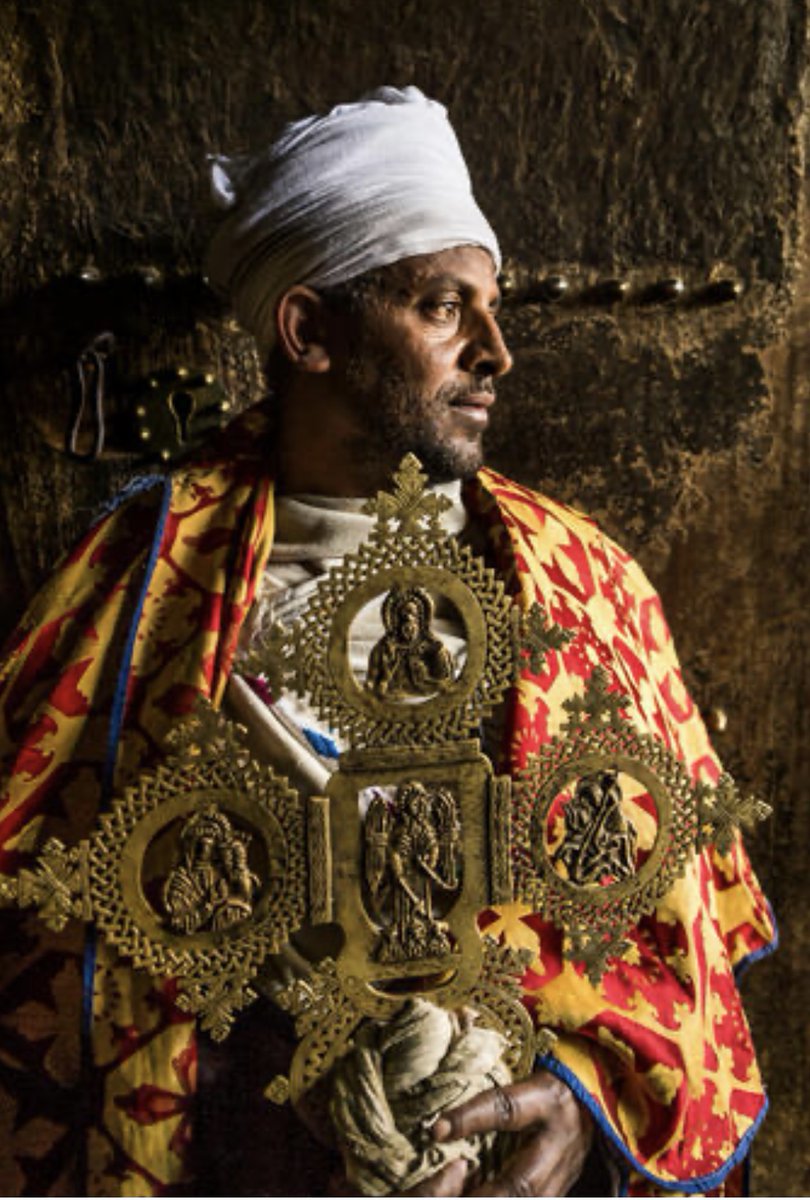A priest stands at the entryway of Yemrehana Krestos Church, a subterranean church 15 km from Lalibela.
#VisitAmhara