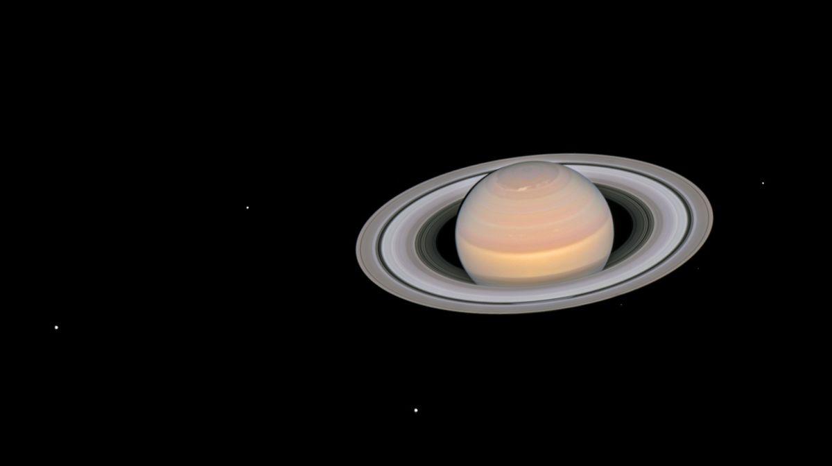 SPACEdotcom's tweet photo. Saturn reclaims 'moon king' title with 62 newfound satellites, bringing total to 145 https://t.co/cEqurnI6Oo https://t.co/hP6IPYzGjB
