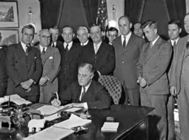 On this day, May 12th, in 1933, President Franklin D Roosevelt signed the Agricultural Adjustment Act into law. Convinced that falling prices were hindering economic recovery, FDR decided that prices were now to be raised by any means necessary.

They succeeded in raising the