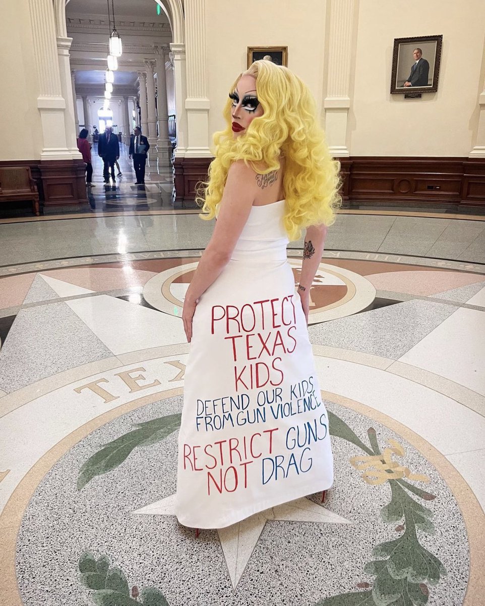 RealMamaBears's tweet photo. Drag queen @BrigitteBandit testified at TX Capitol against SB12 that would restrict drag shows. She wore a dress w the names of victims of 2 TX mass shootings - 1 at a school and 1 at a mall. The back of the dress had “Protect Kids from Guns Not Drag Queens 👸🏼 https://t.co/7FWYT56qa7