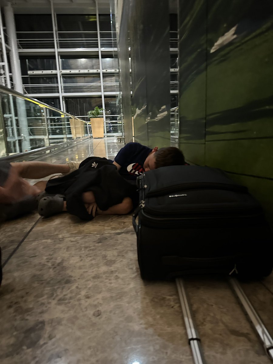 lisa_lambert80's tweet photo. @neilflynn61 @Ryanair My 11 year old sleeping on the floor. https://t.co/q8YM8I3a8C