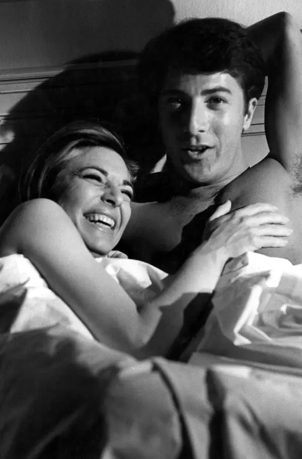Dustin Hoffman and Anne Bancroft between takes on the set of THE GRADUATE (1967).