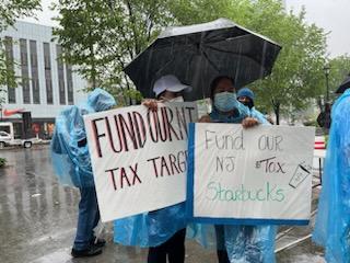 MaketheRoadNJ's tweet photo. #ICYMI: 300 + members of @ForTheManyNJ coalition braved the torrential rain to demand @GovMurphy continue to tax wealthy corporations and #FundOurNJ

Missed the action? Take action with us here: https://t.co/5FHUnVCRWl 

#FundOurNJ #FundOurFamiliesTaxAmazon https://t.co/Xa9HMOzTTC