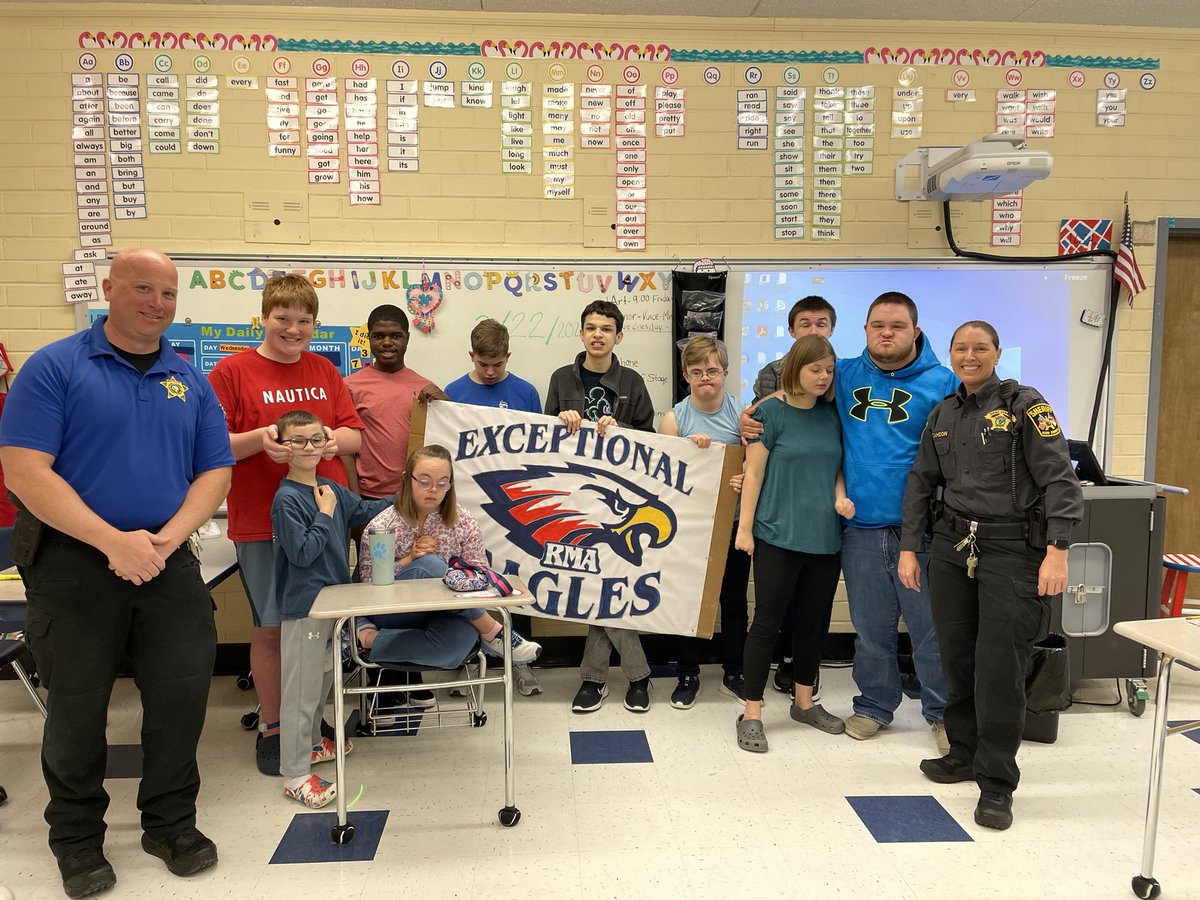 Look at all those happy faces!  

Sergeant Cahoon, who oversees our NC Special Olympics program, recently made some visits to the EC classes at several schools. While there, she gave all the students some Special Olympic t-shirts for their enjoyment.