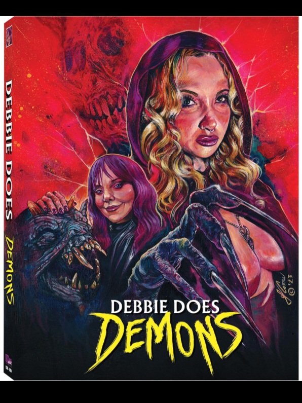 Donaldrighthere's tweet photo. Here's the blu ray slipcover for my new movie #DEBBIEDOESDEMONS. 

That's #JESSAFLUX as Carmilla Karnstein and #ANGELBRADFORD as Debbie. Painting by JUSTIN T. COONS.

Also starring 
#MORRIGANTHOMPSON
#RONIJONAH

Pre-orders begin this month from @cshockreleasing https://t.co/7GJqAqe56y