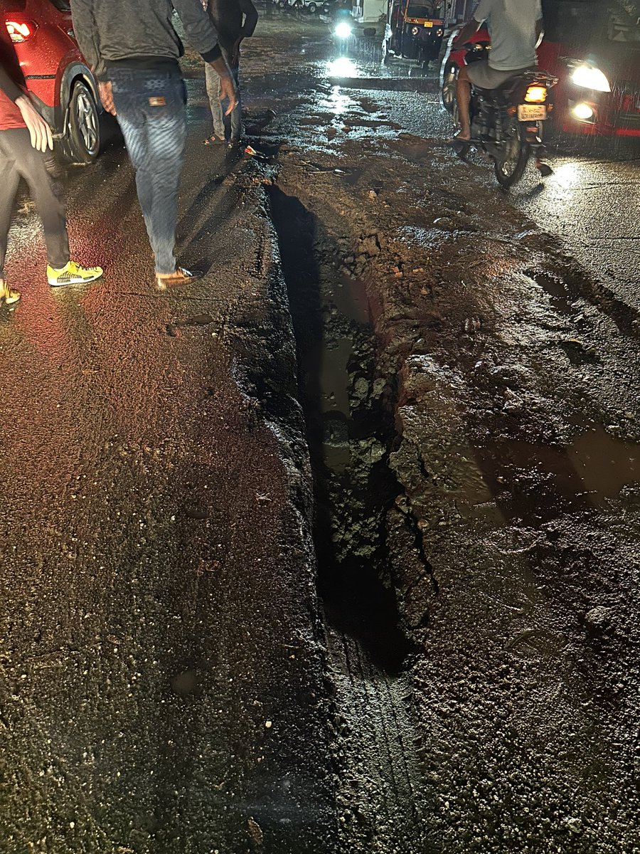 VNLakshmi4's tweet photo. CAR WHEEL STUCK &amp; DAMAGED BECAUSE OF DUG UP ROAD WITHOUT ANY PROPER SIGN BOARD / BARRICADE

I had started from Glen’s bake house and was at a speed of 10km/hr. The road was fully dug at the center and it was not visible at all. It was raining and also no power and no street light https://t.co/yw9uHtH1FT