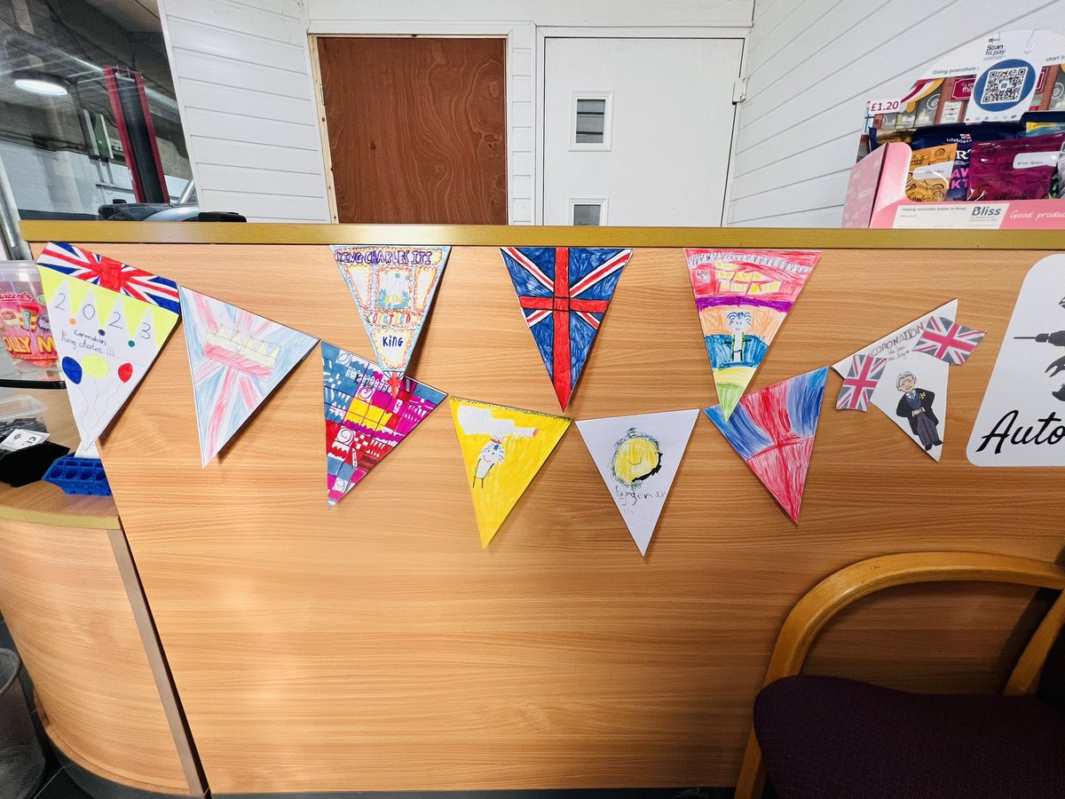 WoodendMOT's tweet photo. This bank holiday, we have mostly been, getting coronation ready.  
Check out the bunting in reception - totally inspired by the children from the local primary schools all designing their own piece &amp; so honoured to display some of them alongside other local businesses.  👏🏻 https://t.co/RJoXKbet0H