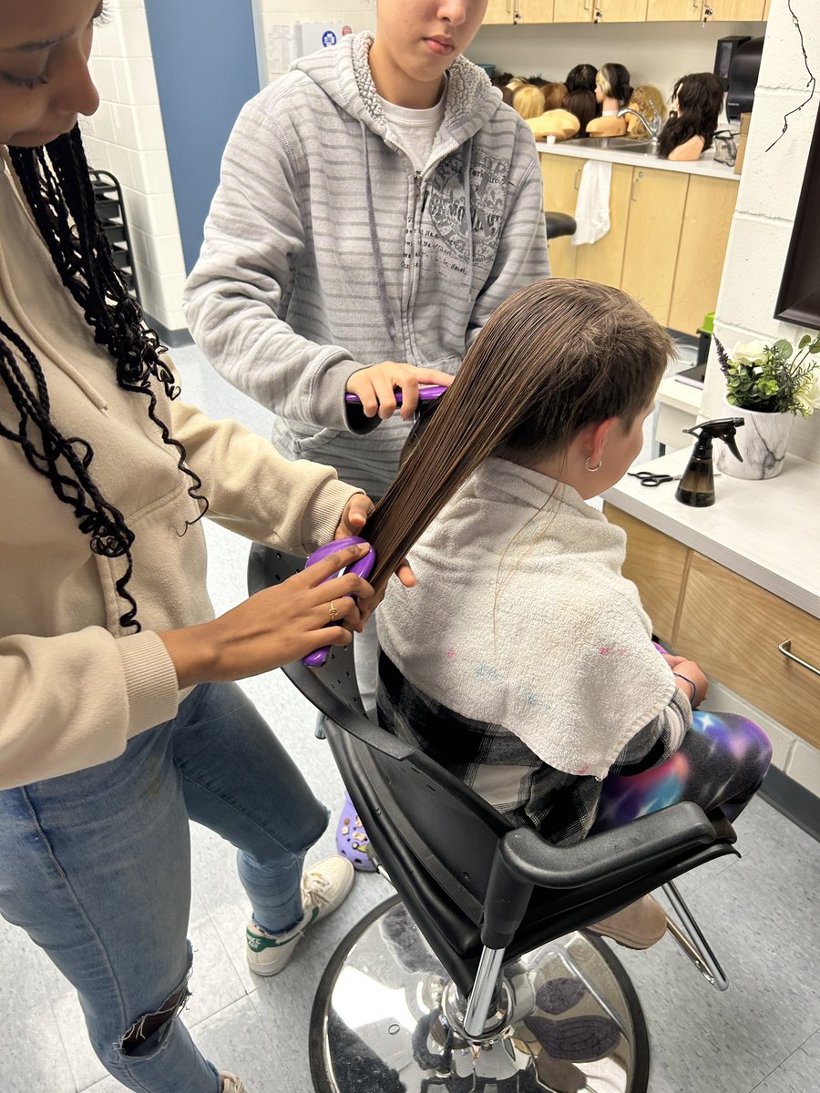 mlle_reeves's tweet photo. We love a live model session!!! Students in hairstyling pampering Ms. Deslauriers daughters in Grade 3 &amp; 5! They came in to Trinity today to have their hair cut and styled 😎😍🤩 @HolyTrinityOCSB https://t.co/7VSSTAkWuz
