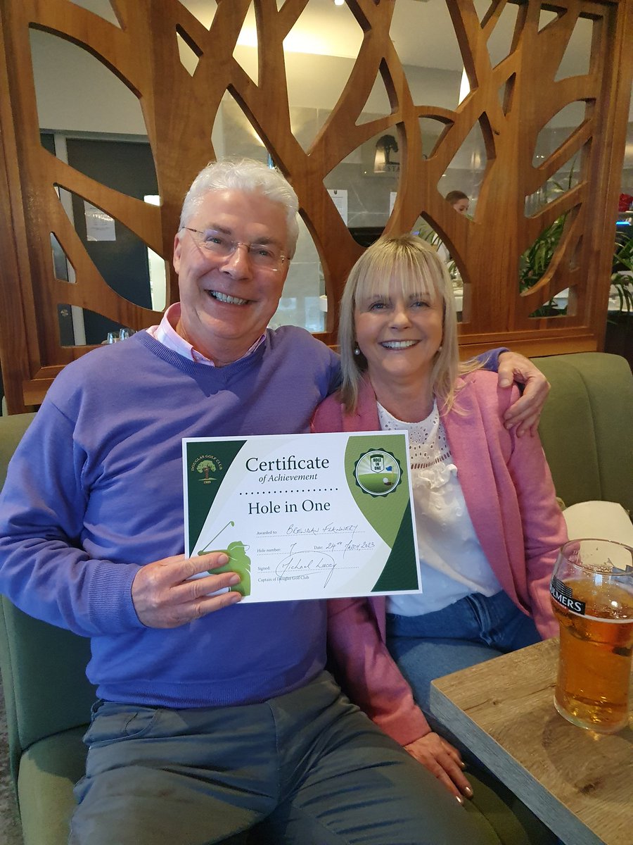 Brendan Flannery, pictured here with his wife Noreen, celebrating his recent hole in one in DGC. Brendan has the distinction of a clean sweep of making a hole-in-one on each of the par 3 holes in DGC.