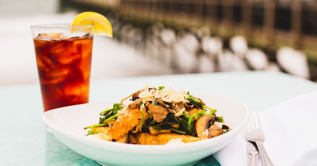 OceanicDining's tweet image. Did someone say vegetarian dishes are boring? Well, not here. Our Carolina Grit is addictive and savory, and you won't be able to hold off on that final bite
Creamy grit cake with sauteed wild mushrooms, spinach, aromatic garlic, shallots, and drizzled in a truffle crème fraîche