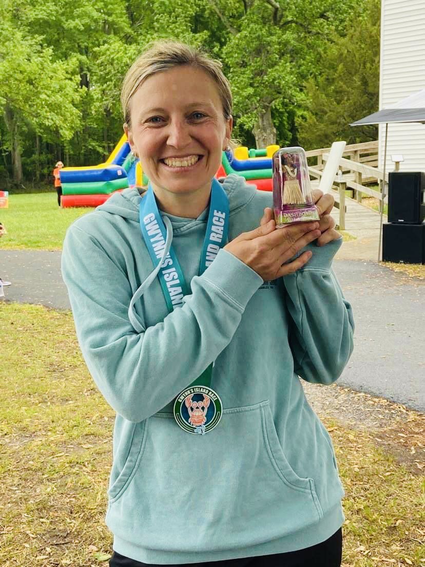MrsHarrisGCPS's tweet photo. Came in first female overall at the Gwynn’s Island Race this weekend! 4 miles turned into 4.5 after a turn sign blew over, but we pushed through. One of my fav races with the hula girl awards! #MedalMonday https://t.co/w5KANzpY0f