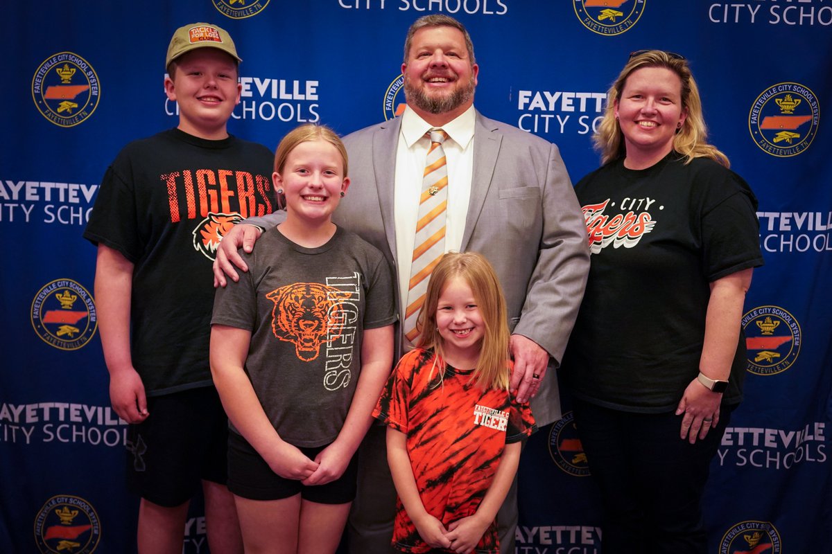 FCSTigers's tweet photo. The Fayetteville City School Board voted unanimously  to authorize the finance committee to negotiate a contract with Eric Jones to begin serving as the system’s next Director of Schools on July 1. Mr. Jones, pictured with his family, is a supervisor &amp; assistant director with FCS https://t.co/U5S7pWVrJ9