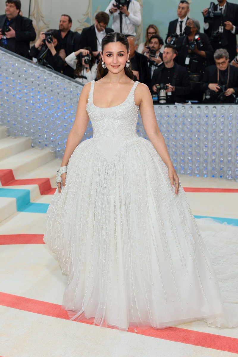 gqindia's tweet image. #AliaBhatt makes her debut at #MetGala 2023 wearing a Chanel bride-inspired #PrabalGurung white gown.