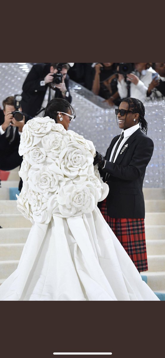 WondyrGroup's tweet photo. Rihanna and Asap Rocky share a moment at the Met Gala #MetGala https://t.co/5m4BOW3NKg