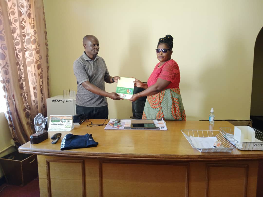 Did you know?
The People's Human Rights Manifesto is also a tool that ordinary Zimbabweans can benchmark, monitor, evaluate and report on the performance of elected officers.

In the image below, ZimRights Mashonaland West Chairperson (Left) hands over a copy of the Manifesto to