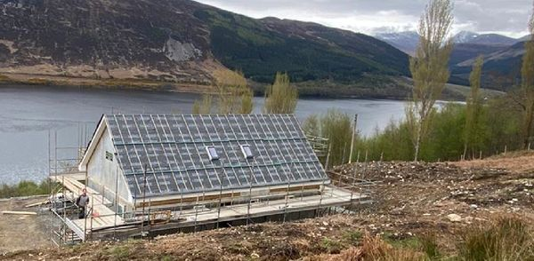 HAUStimberframe's tweet photo. Who doesn't like our Rousay Vaulted HAUS with this view, snow visible on the mountain tops in May makes the Scottish landscape. How can HAUS help you?    https://t.co/7Bj8juGvIK https://t.co/OKJc9UrCid