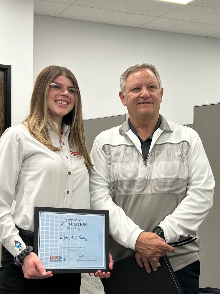 ServiceUniform's tweet image. Team members Saige Alberg and Huong Dao are celebrating their 4 and 17-year anniversaries, respectively. General Manager Dennis Tschida, who presented them with certificates of appreciation, has also reached an impressive milestone — 44 years with Service Uniform!