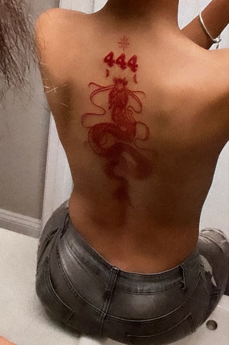Freehand chakra tattoo on the spine in red ink  Instagram