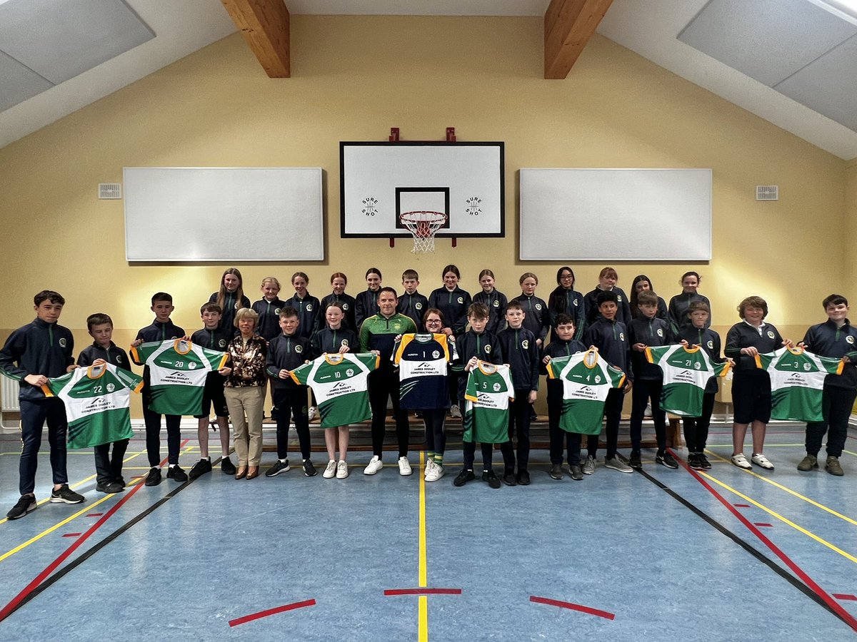 scoilnaomhbride's tweet photo. A huge thank you to one of our past pupils, @JamesDooley1 who kindly sponsored a set of school jerseys. He presented them to 6th class pupils today. The girls play Cushinstown in the @RackardLeague semi final in Killurin at 3pm tomorrow, so they’ll have their first outing! https://t.co/NzMSMrJq1f
