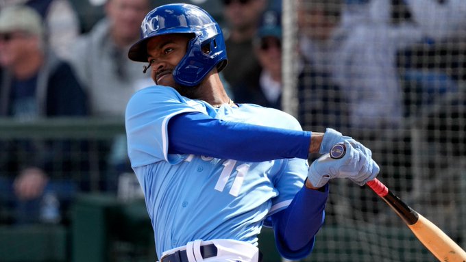 Maikel Garcia follows through after a swing while wearing the Royals blue uniform.