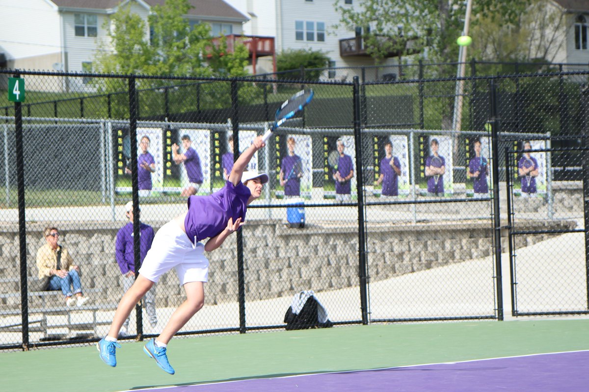 Rocco Regnier (10) serves the ball over the net against Clayton this afternoon. Regnier looks to repeat as district champion this season. Photo by Robbie Diener. #ehs63025