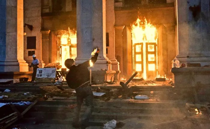 habitualasshole's tweet photo. On this day 9 years ago, nearly 50 people demonstrating against the U.S.-installed, post-Maidan coup regime in Kiev were burned alive in the Odessa Trade Union building. The massacre was orchestrated by many reactionary forces including ultranationalists and neo-Nazis, but also included local police and, such is the case for Aleksey Goncharenko, soon-to-be elected European politicians. “Slava Ukraini” — a slogan originated by Stepan Bandera during his collaboration with the Nazis in WWII — and the Ukrainian national anthem can be heard shouted and sung proudly in footage of the horrific event, as living bodies within the building continued to burn. Some of them were minors. By the end of it all 42 people were burned alive and 6 were shot dead. 

The massacre has largely been ignored by Western media. On this day, nearly a decade later, we remember Odessa.