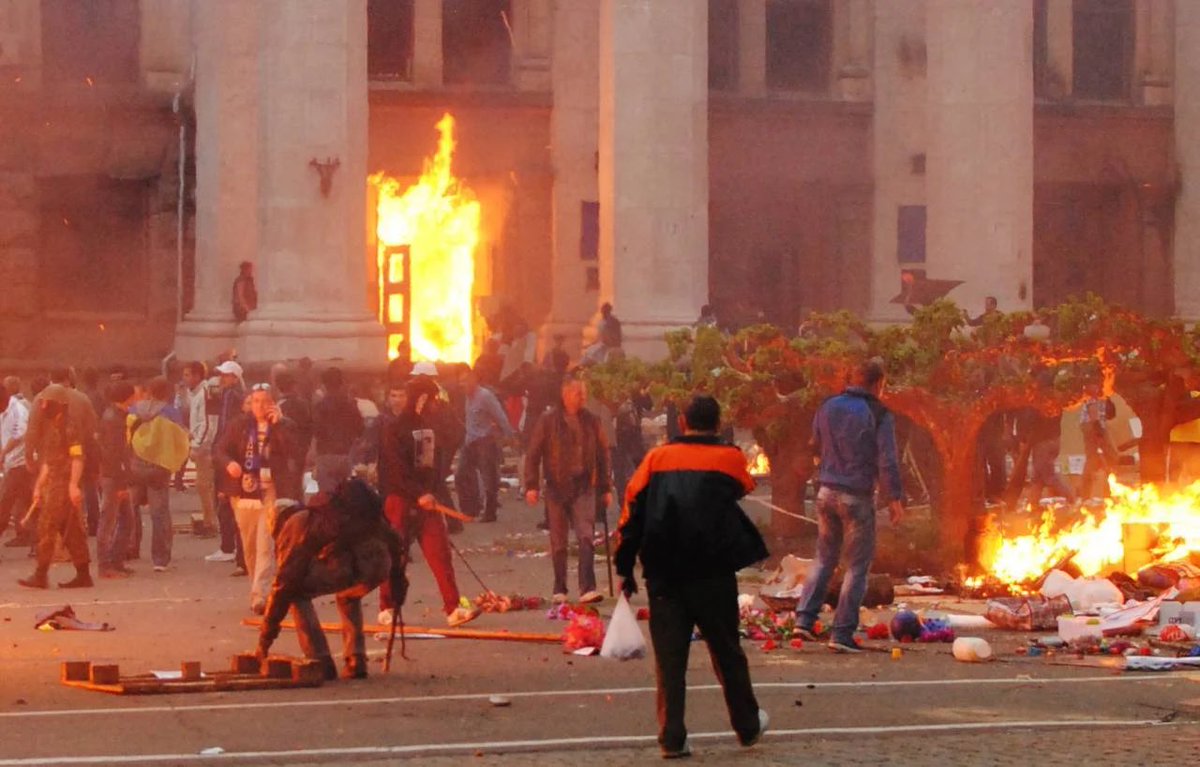 habitualasshole's tweet photo. On this day 9 years ago, nearly 50 people demonstrating against the U.S.-installed, post-Maidan coup regime in Kiev were burned alive in the Odessa Trade Union building. The massacre was orchestrated by many reactionary forces including ultranationalists and neo-Nazis, but also included local police and, such is the case for Aleksey Goncharenko, soon-to-be elected European politicians. “Slava Ukraini” — a slogan originated by Stepan Bandera during his collaboration with the Nazis in WWII — and the Ukrainian national anthem can be heard shouted and sung proudly in footage of the horrific event, as living bodies within the building continued to burn. Some of them were minors. By the end of it all 42 people were burned alive and 6 were shot dead. 

The massacre has largely been ignored by Western media. On this day, nearly a decade later, we remember Odessa.