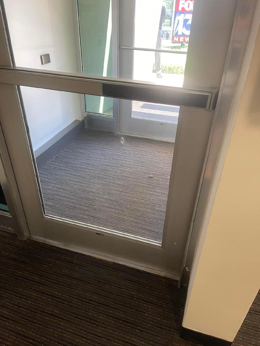 SheliaOConnor's tweet photo. UPDATE: we have been let back inside the station, but we’re still on lockdown. Here’s more photos of the bullet hole. Memphis police have the guy in custody. @FOX13Memphis https://t.co/PbF4uWFOUq