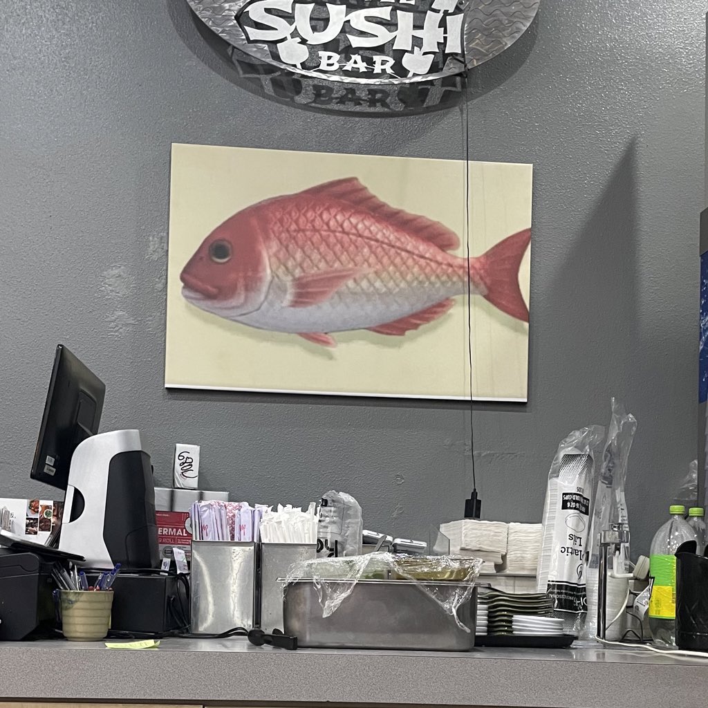 unicornyjokes's tweet photo. the sushi restaurant im at has a really low quality picture of the animal crossing red snapper hanging up on the wall https://t.co/MsT4wgz40u