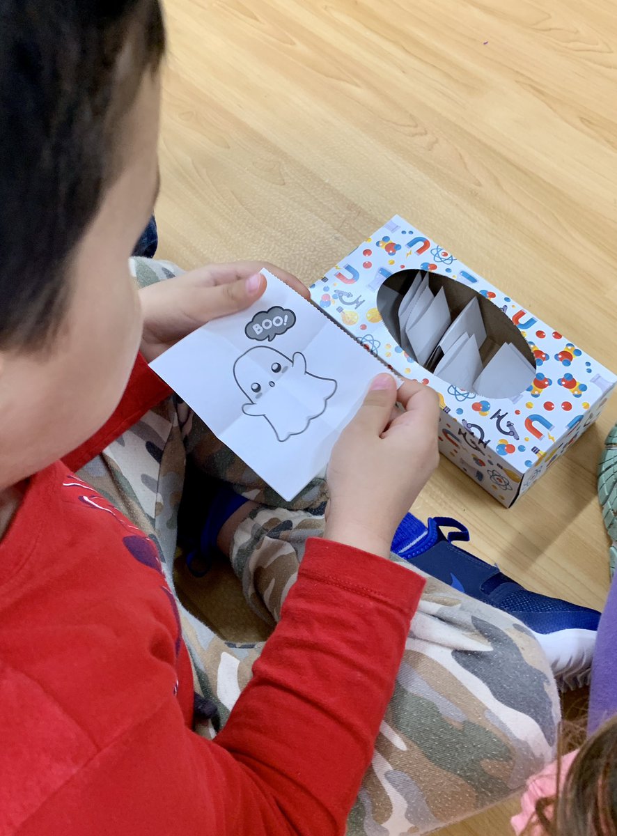 We learned a new game called ‘Boo!’  Pull a piece of paper from the box, read out the number, pass the box along the circle. If you pull the ghost out, try and scare us with a big loud BOO! 👻 <a href="/oakwrdsb/">Oak Creek PS</a>