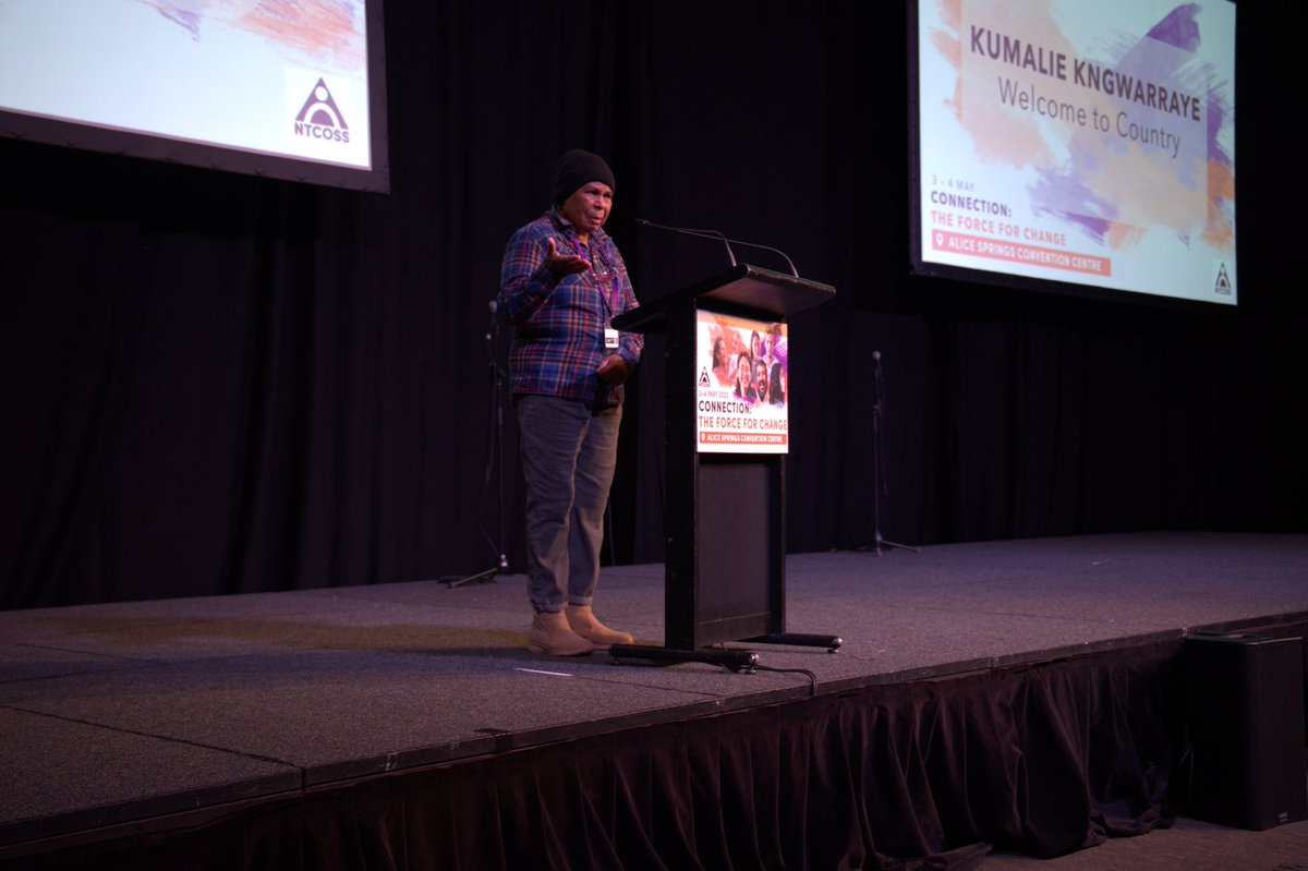 NTCOSS's tweet photo. Proud Arrernte elder and artist Kumalie Kngwarraye delivered a powerful Welcome to Country at the #NTCOSSconference Aboriginal people had the right to self determination and to live according to their own culture, she said, highlighting the importance of the Voice Referendum. https://t.co/Oj7bLZFsPK