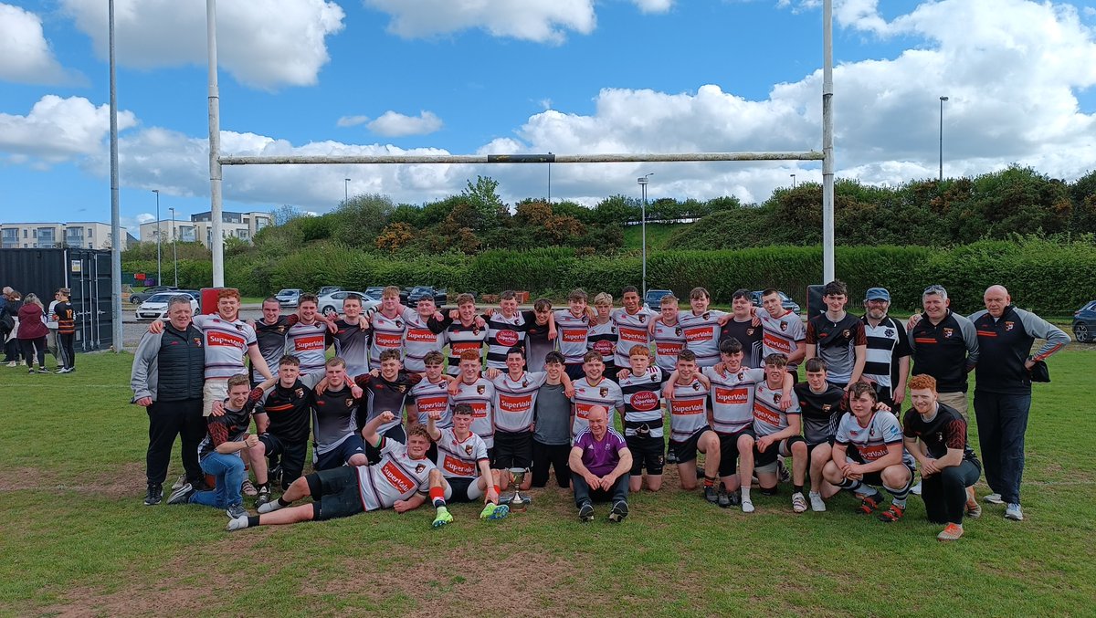 BallincolligRFC's tweet photo. Congrats to our under 18s on their epic win in the final! The pictures of our team and their families after the match perfectly capture the joy and spirit of our #rugbyfamily. We're so proud of everyone involved! 🎉👨‍👩‍👧‍👦🏆 https://t.co/EUU3ofg0PU