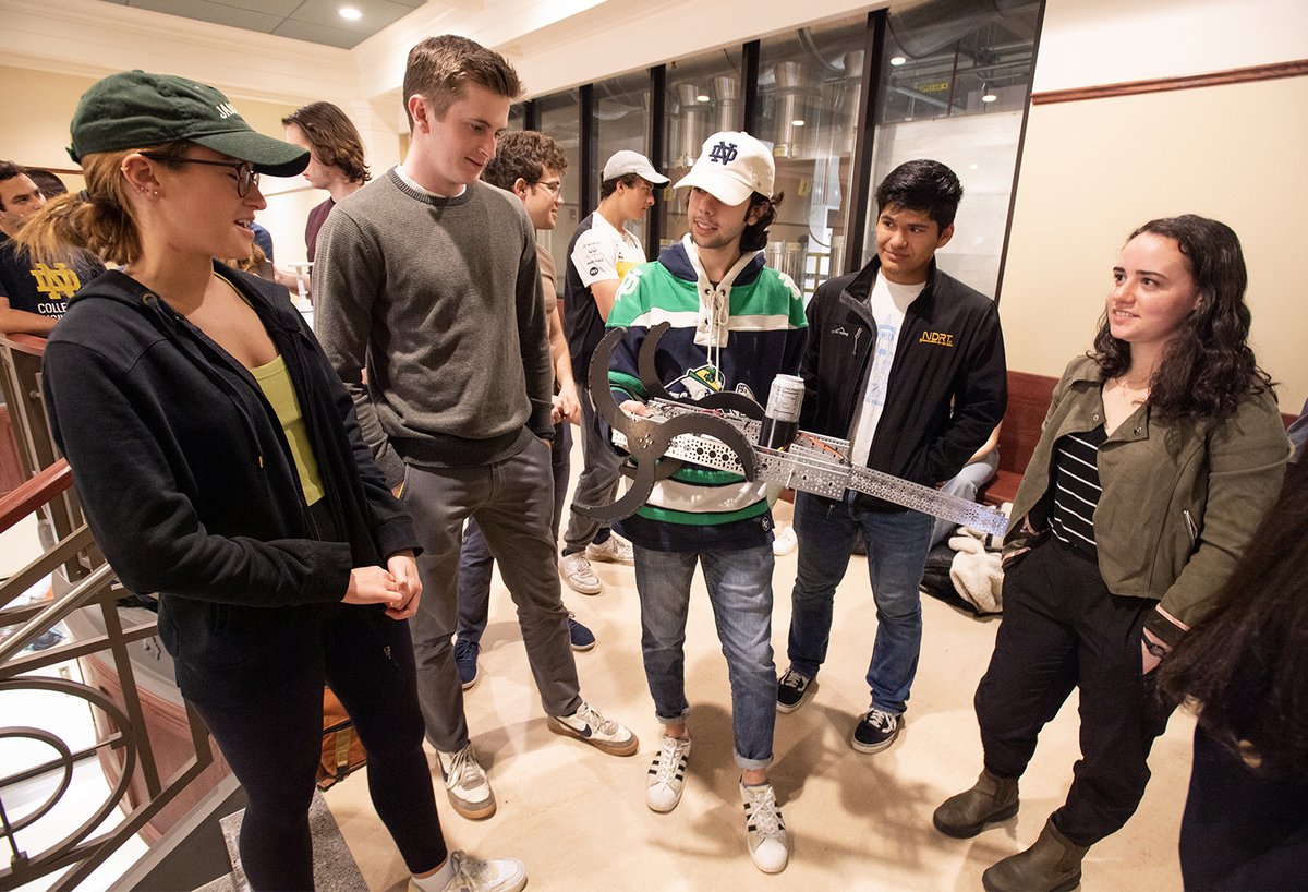 NDengineering's tweet photo. To encouraging cheers and applause, the student-designed robots in the Design Tools 2 class @NotreDame do their best to climb the stairs. https://t.co/q7VQKLt3bB