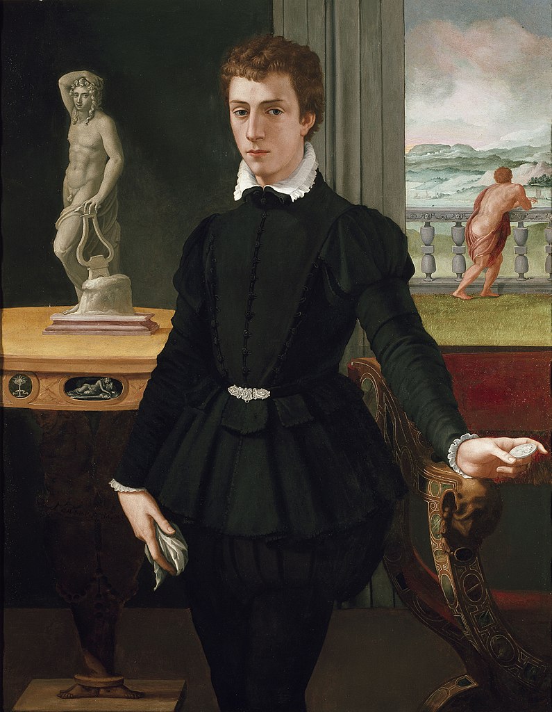 Young man in black, 1560. Beside him, naked statue. Behind him, naked man in the garden. Also check out the table, which has human-shaped feet! Must be mannerism, from Alessandro Allori, born OTD 1535