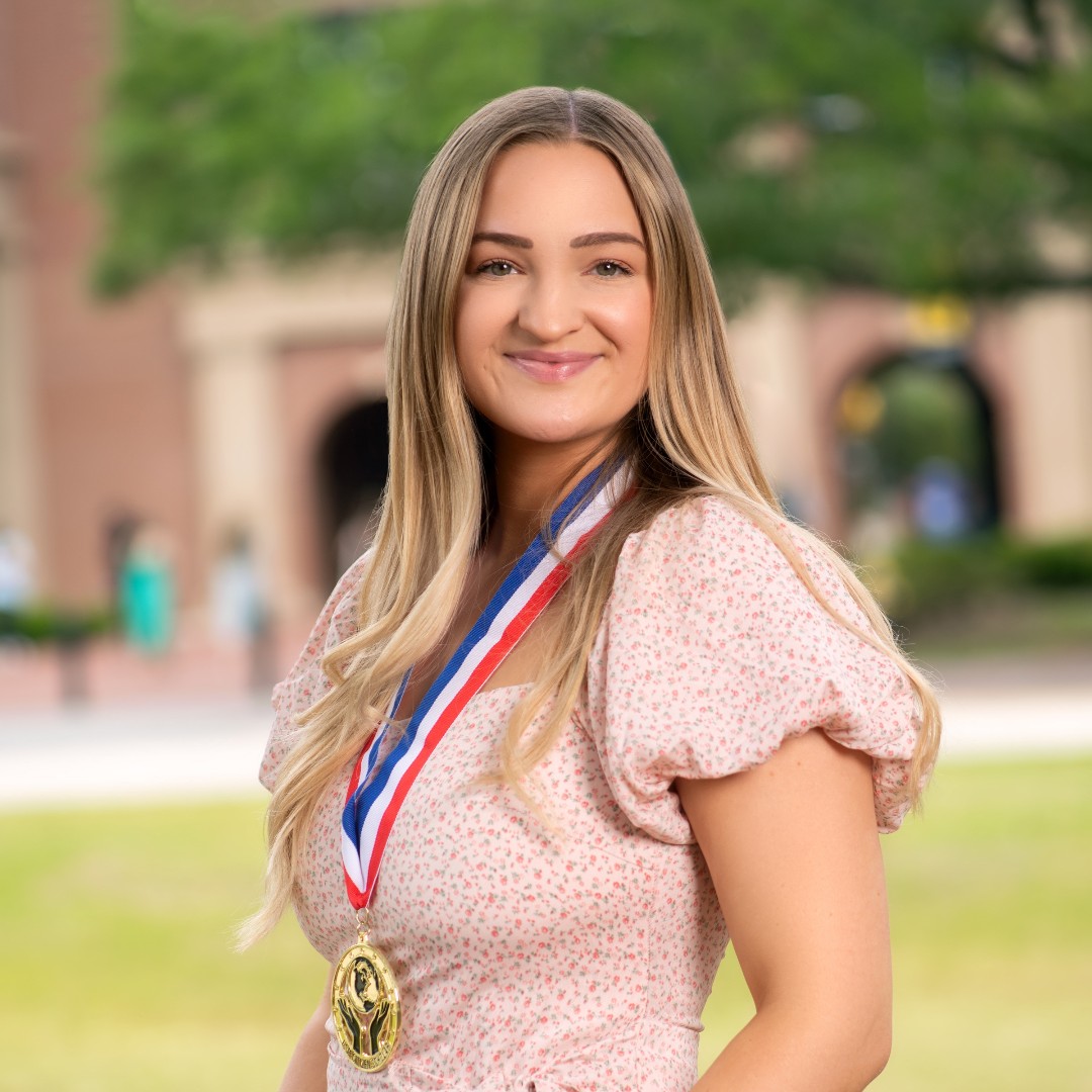 Bailey Davis, who will be graduating with 197 service hours. Bailey participated in a community-engaged learning experience over the summer of 2022 in which she traveled with Special Olympics athletes to Florida for the national competition.  Congratulations Bailey!