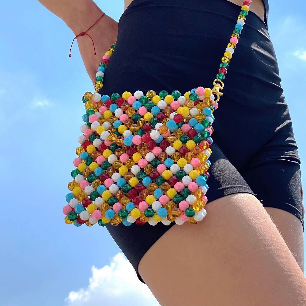 Bring a little color to your life with this stunning hand-beaded bag that's sure to turn heads and brighten up your day 💐🌈 Available now at @arttepuydc.
