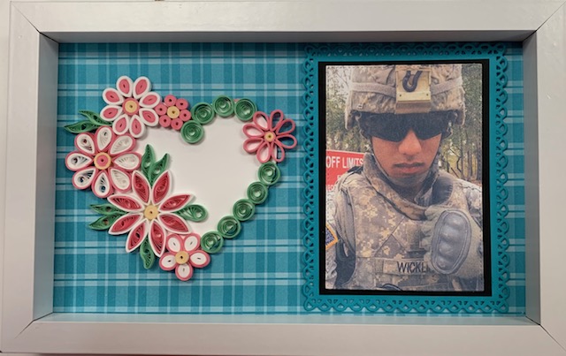 TAPSorg's tweet photo. A recent TAPS Togethers event in Edmond, OK, brought military survivors together to learn the centuries old art of #quilling. Everyone created a framed piece of art featuring a photo of their fallen hero. Thank you to #ARWorkshop for hosting this time of crafting & connection! https://t.co/XI00nxfv2p