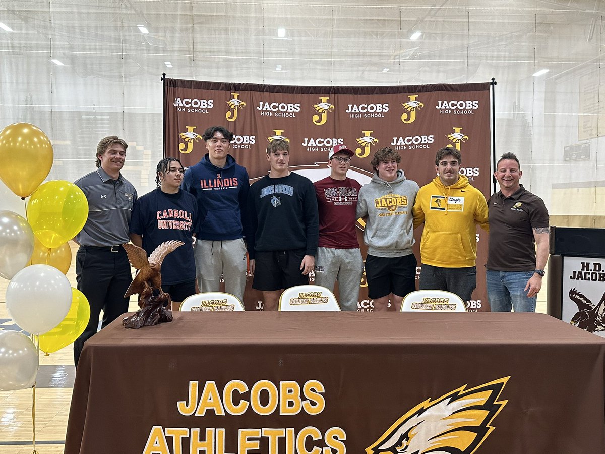 HDJacobsFBall's tweet photo. Celebrating today our 7 who will play in college🦅🏈
@NickTrue16 at @IlliniFootball 
@seibert_will at @JHU_Football 
@only1juan_ at @piofootball 
@dinohunt22 at @AugieILfootball 
@kyle_koziel75 at @AugieILfootball 
@dylan_c_35 at @RoseHulmanFB 
@_antoniobrown8  at @BSUBeaversFB https://t.co/Yja0Q6AaVq